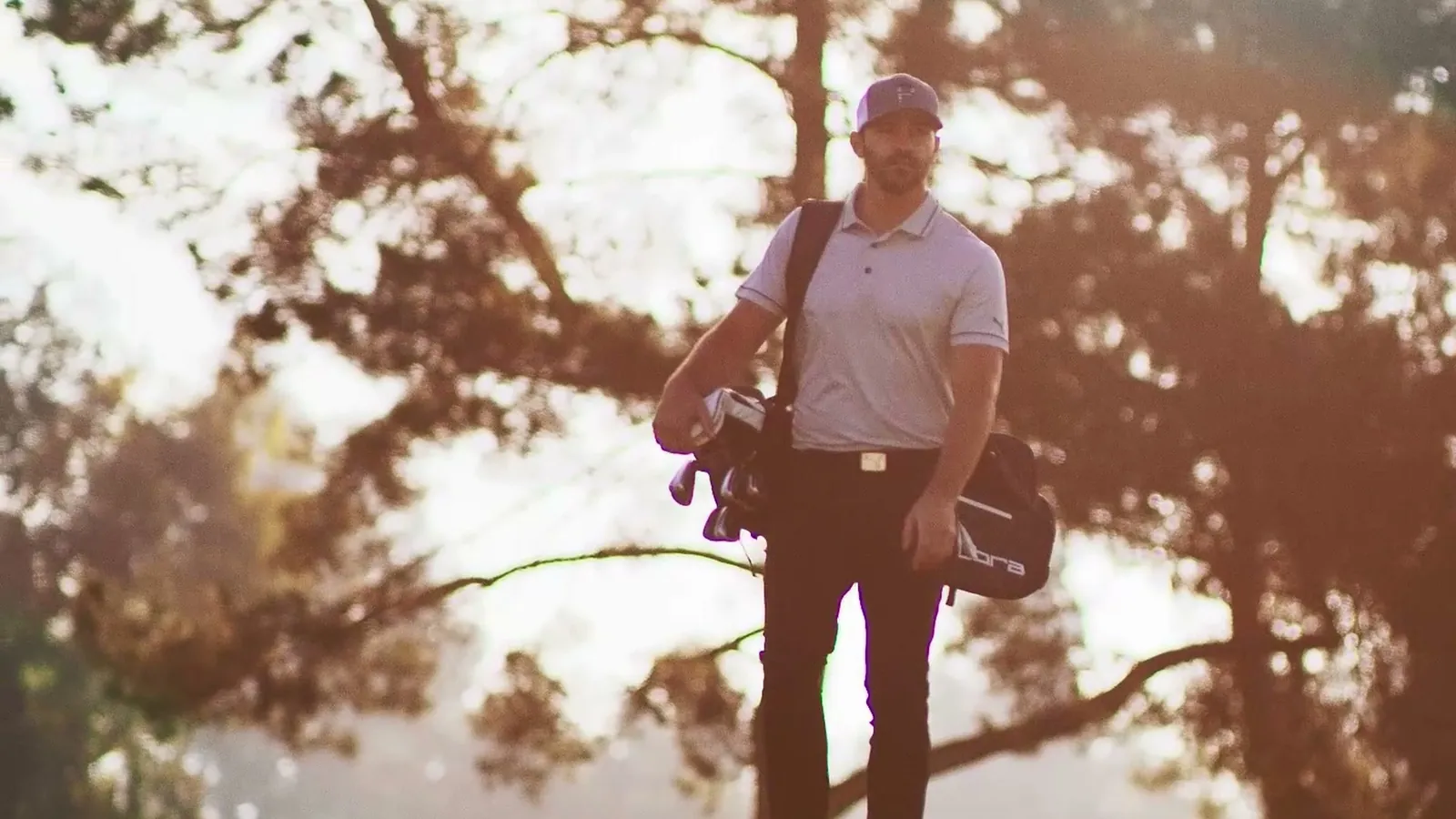 A golfer walks off the course at golden hour, from the Cobra Puma Golf film