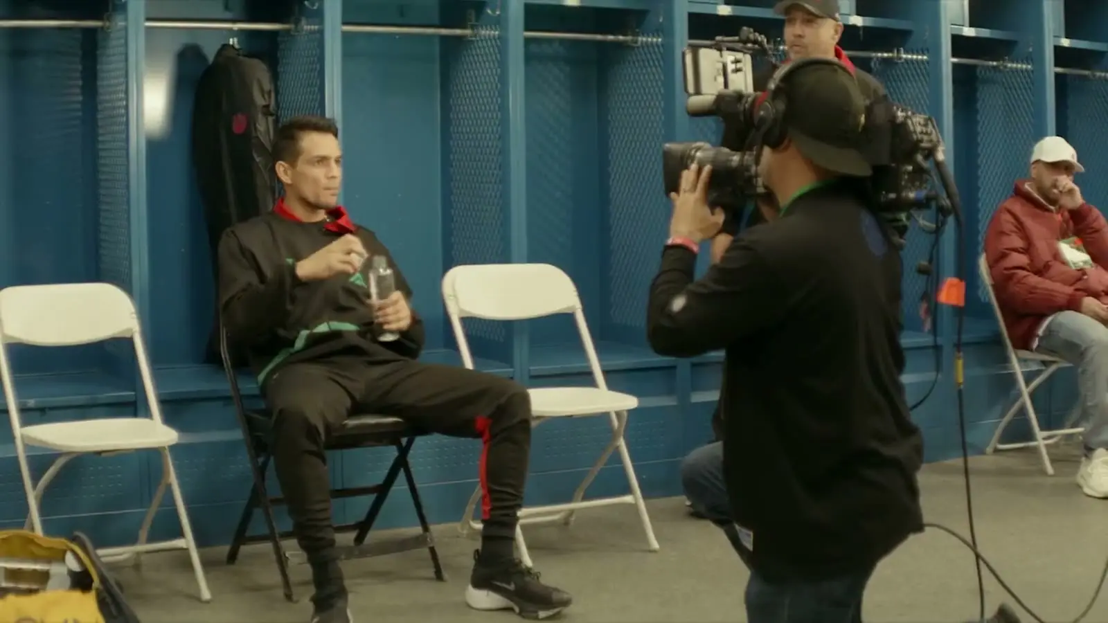 MUUS filming a fighter in the locker room