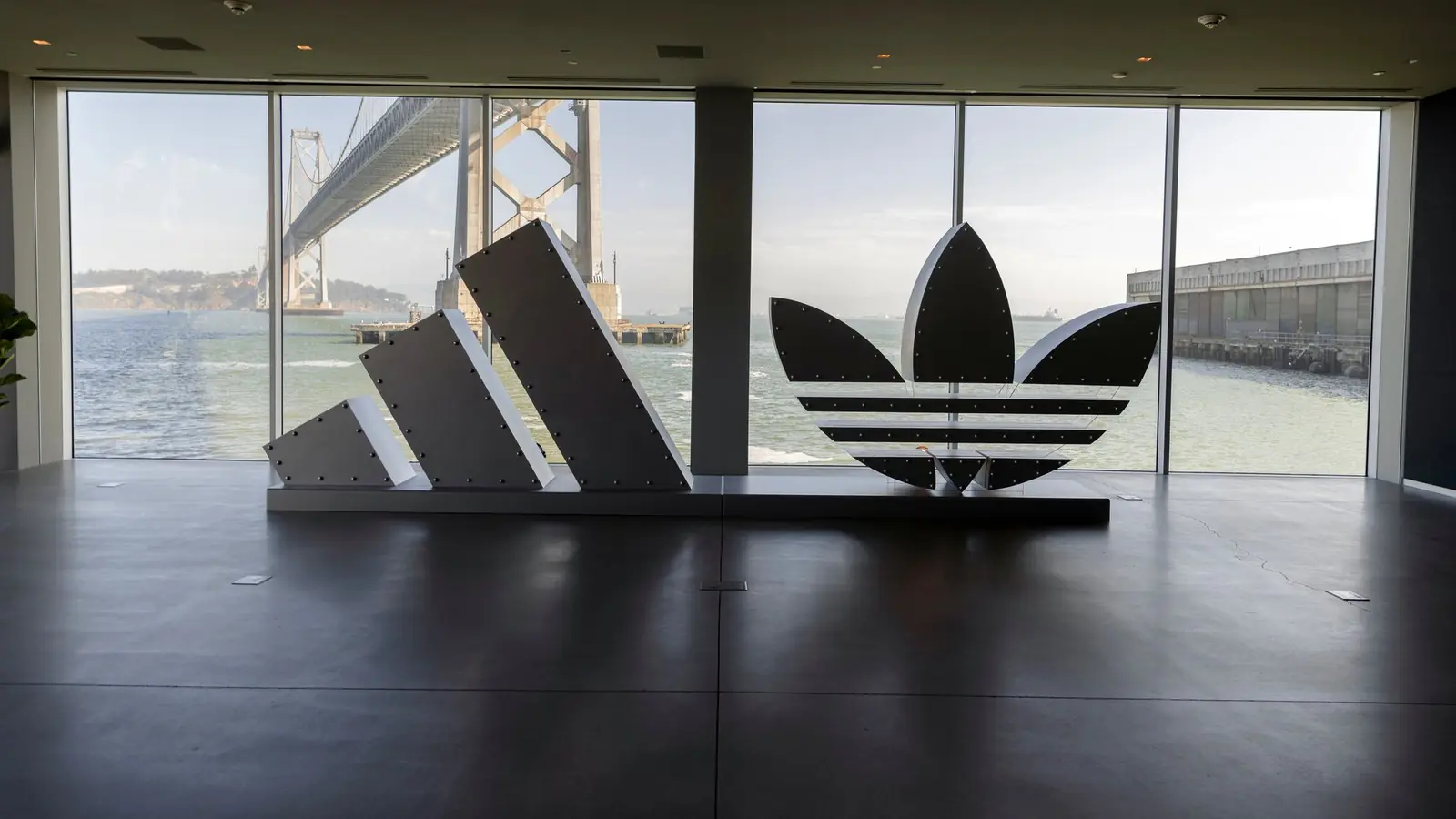 The adidas Badge of Sport and Trefoil built at full scale against the Bay Bridge