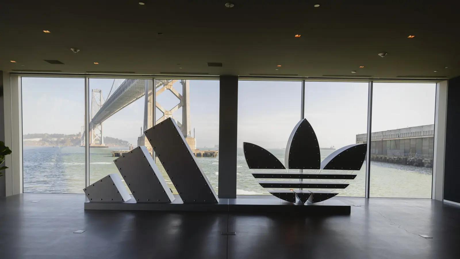 The adidas Badge of Sport and Trefoil built at full scale against the Bay Bridge