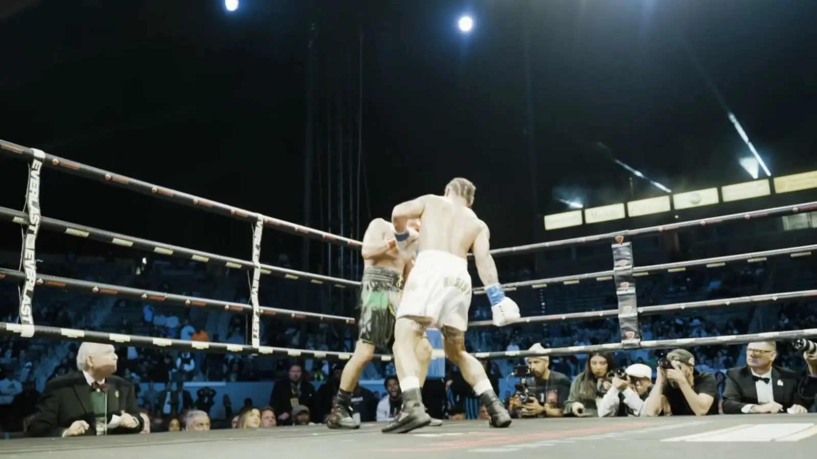 Two fighters under the arena lights