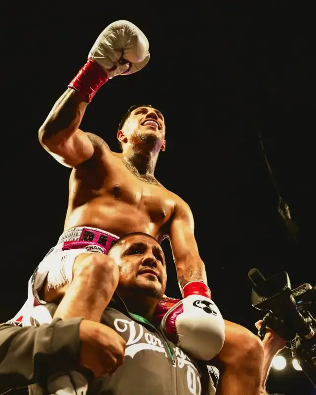 A fighter lifted on a shoulder in the ring after a WBC fight